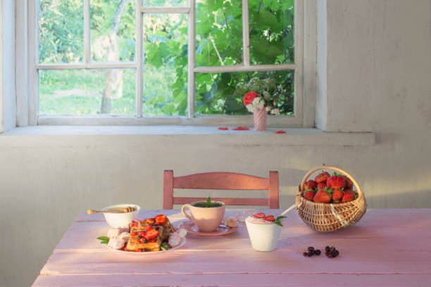 breakfast with strawberries on pink wooden table
