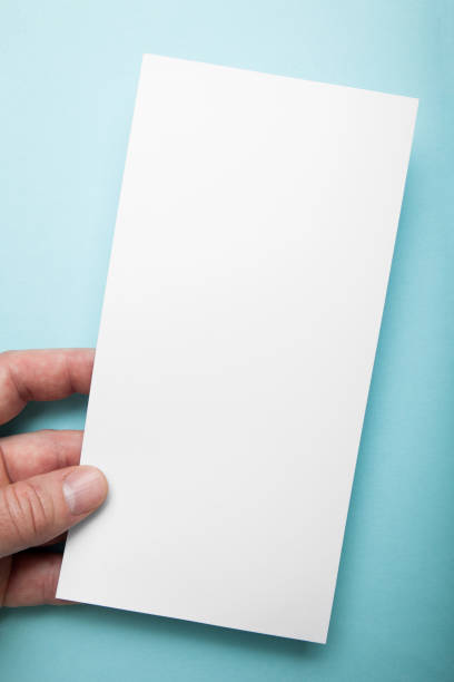 istock Invitation to the event in hand on a blue background 983222424