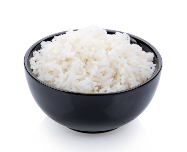 istock Rice cooker in a black bowl on white background 983228570