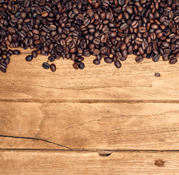 istock Coffee on grunge wooden background 983235330