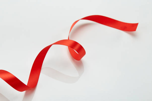 istock fabric red ribbon on a white Background 983236002