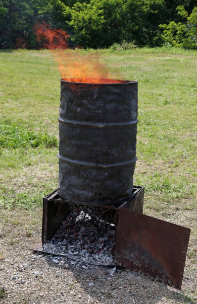 istock sheet metal bin with flames of fire 983236322