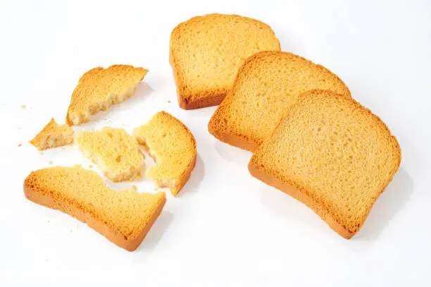 crushed bread rusks isolated over white background