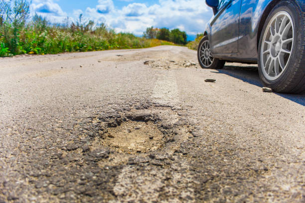 istock bad road cracked and damaged 983239280