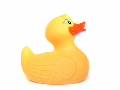 Î¥ellow and orange color rubber ducks isolated on transparent background, Ducks in a row.