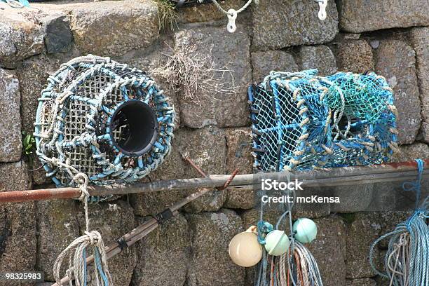 Lobster Pots Against Harbour Wall Stock Photo - Download Image Now - Buoy, Coastal Feature, Color Image