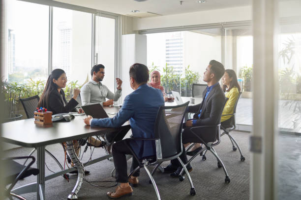 istock Multi-ethnic professionals discussing in meeting 983291252