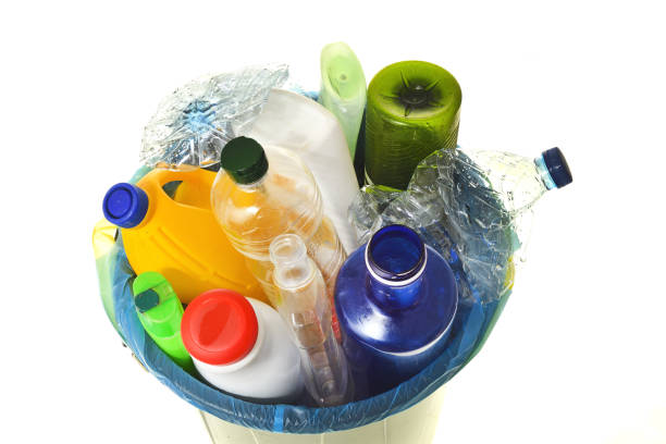 istock garbage bin full of bottles to recycle on white 983302188