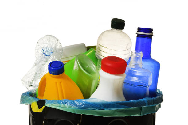 istock garbage bin full of bottles to recycle on white 983302216