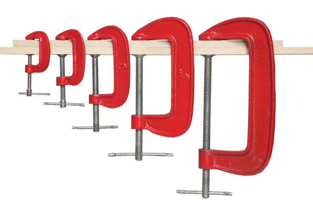 istock Set of red clamps isolated on white background. 983308758
