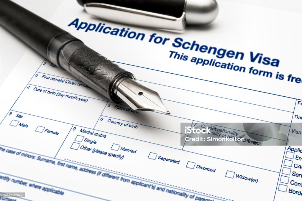 close up from a Application for Schengen visa and passport Schengen Agreement Stock Photo