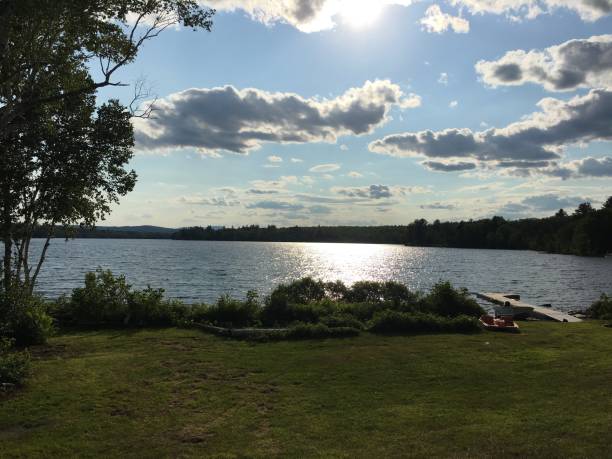 istock Dramatic summer sky at dusk reflected in Lake Hebron in Monson, Maine 983321888