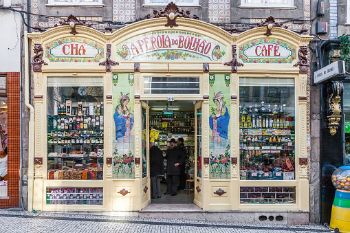 Porto, Portugal - December 29, 2014: A Perola do Bolhao grocery store. This historical delicatessen shop is decorated in the Art-Nouveau style and dedicated to sell traditional Portuguese products.