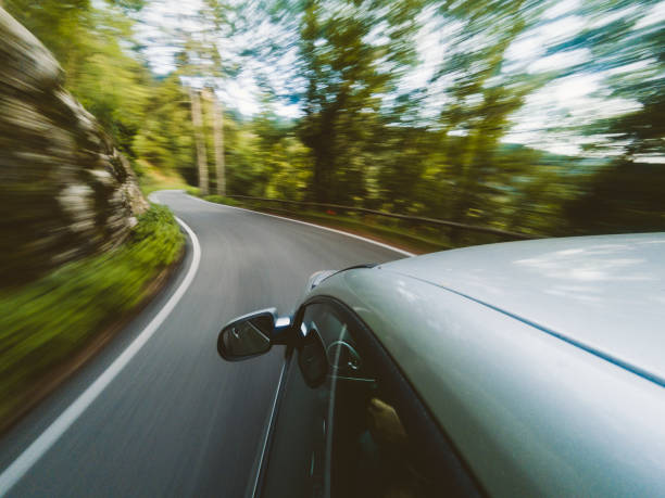 istock Road trip in the middle of the forest. Motion blur 983342684