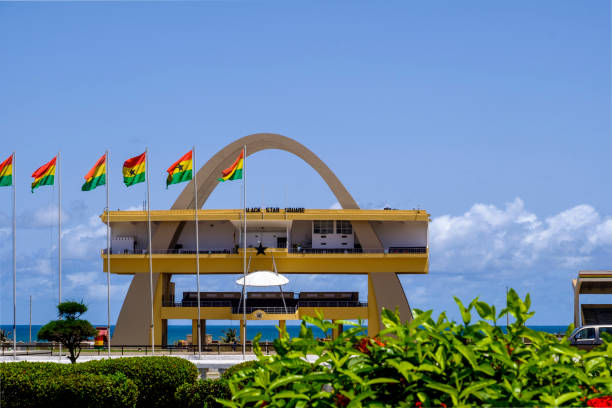 Black Star Square Arch ACCRA,GHANA - APRIL 11 2018: Black Star Square. Independence Arch and flags of Ghana in Accra's Independence Square, site of Independence Day parades and national celebrations soldier on the wall stock pictures, royalty-free photos & images