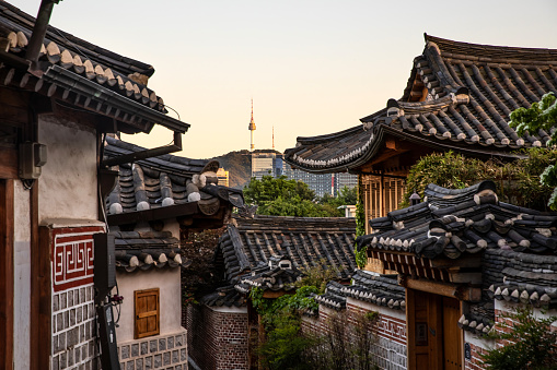 Korea Old House traditional house, Namsangol Hanok Village and Seoul Tower background, Village of Traditional Houses in the Namsan Valley, Seoul, South Korea.