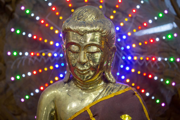 A statue of Buddha surrounded by LED lights in the Chaukhtatgyi Buddha Temple in Yangon.