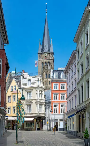 Aachen in city in Germany, commercial pedestrian street and church tower
