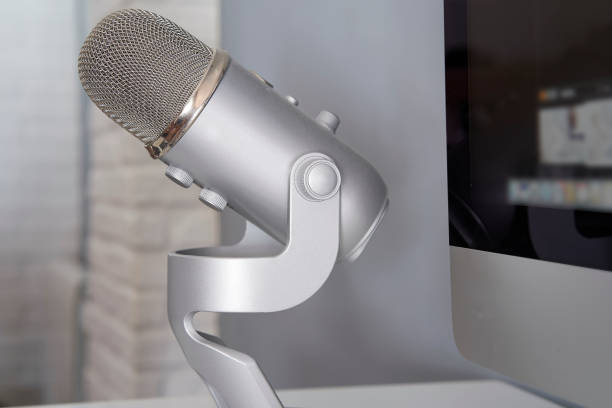 Grey microphone on a white table