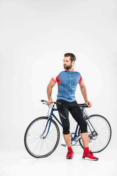 istock handsome bearded sportsman with bicycle, isolated on white 983377868