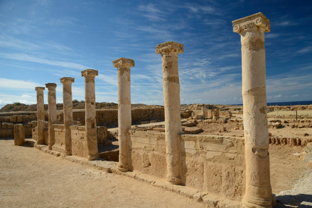istock Row of ancient columns against blue sky background 983398406
