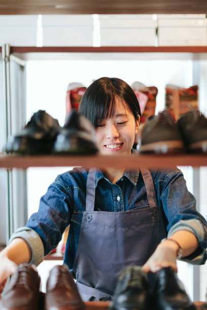 istock Woman working at shoe store 983411446