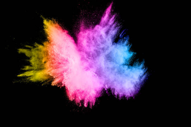 istock Multi color particles explosion on black background. Colorful dust splatter on dark background. 983412088