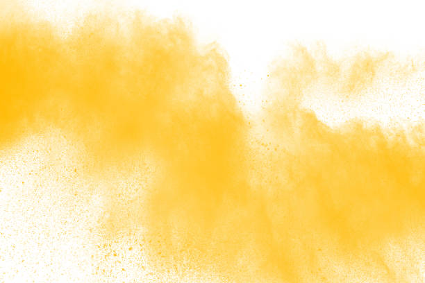istock abstract yellow dust explosion on  white background. abstract yellow powder splatter on white background. Freeze motion of yellow powder splash. 983412096