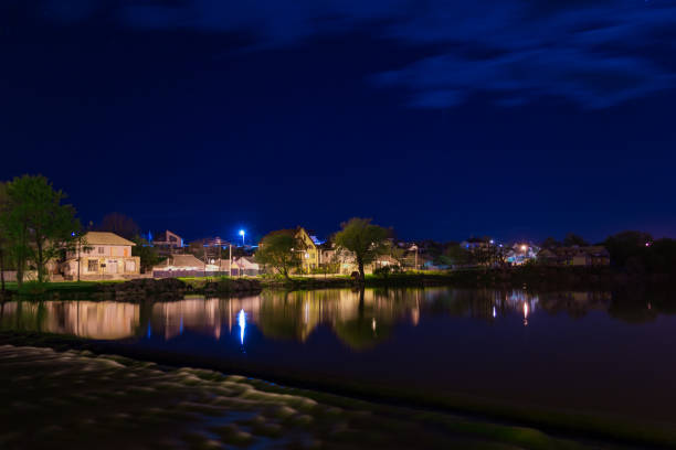 istock night long exposure photo of river and lights 983416462