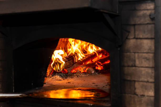 istock Traditional wood-burning oven lit with refractory bricks in igloo format 983430154