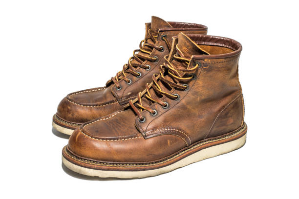 istock A pair of Brown Leather Boots on white background, isolated 983430442