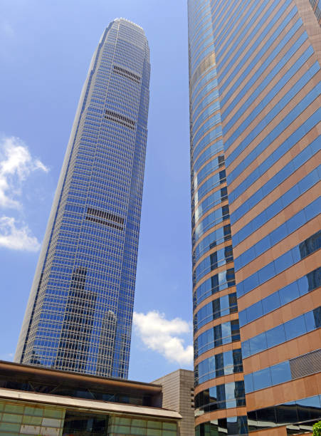 istock Tall Glass Skycraper IFC building in Hong Kong with blue sky 983432580