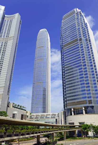 istock Tall Glass Skycraper IFC building in Hong Kong with blue sky 983432978