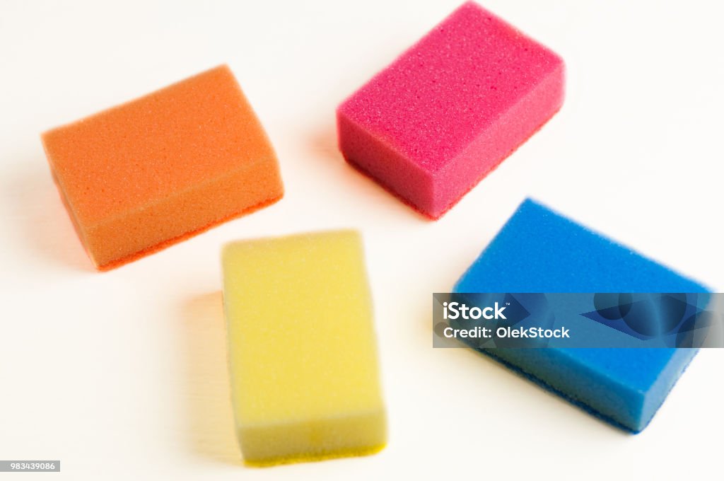 Scattered Four Red Blue Orange And Yellow Sponges For Dishwashing On White  Background Cleaning Concept Stock Photo - Download Image Now - iStock