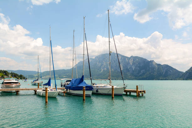 Jetty in Unterach at lake Attersee in austrian alps near Salzburg, Austria Europe Jetty in Unterach at lake Attersee in austrian alps near Salzburg, Austria Europe attersee stock pictures, royalty-free photos & images