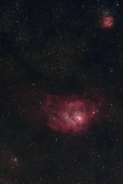The Lagoon Nebula, the Trifid Nebula, and the globular cluster NGC 6544 in the constellation Sagittarius as seen from Mannheim in Germany.