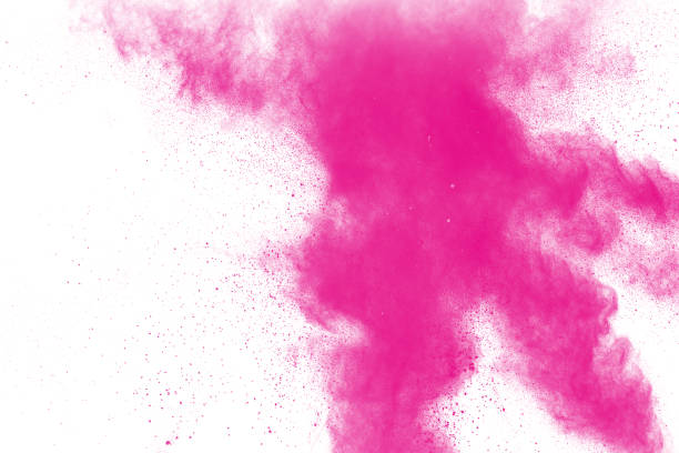 istock pink particles explosion on white background. Colorful dust splatter on white background. 983457762