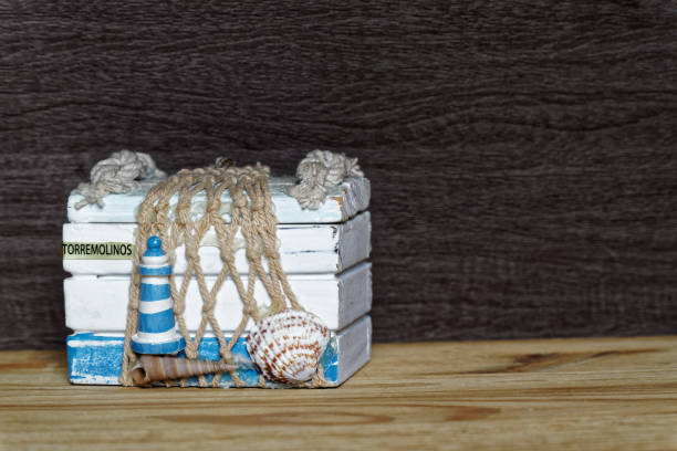 Closed Vintage decorative chest on wooden table.