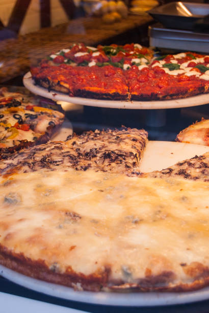 istock Slice of pizza exposed in a bakery 983458464