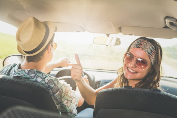 istock Happy couple on summer vacation road trip. 983462414