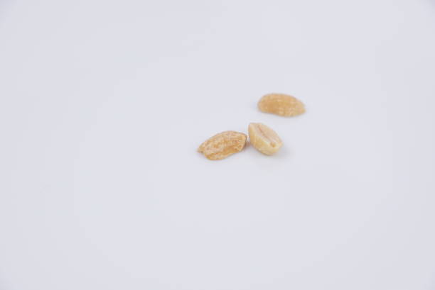 istock Grains of peanut on a white background 983489796