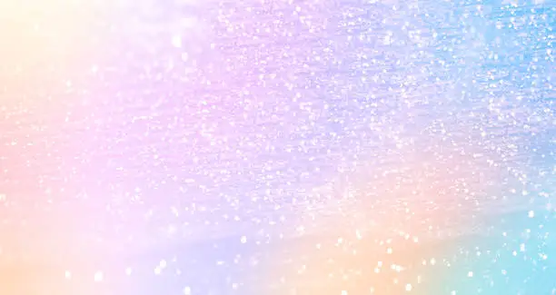 Photo of Glittering gradient background  with hologram effect and magic lights. Holographic  abstract fantasy  backdrop  with fairy sparkles, gold stars and festive  blurs. 