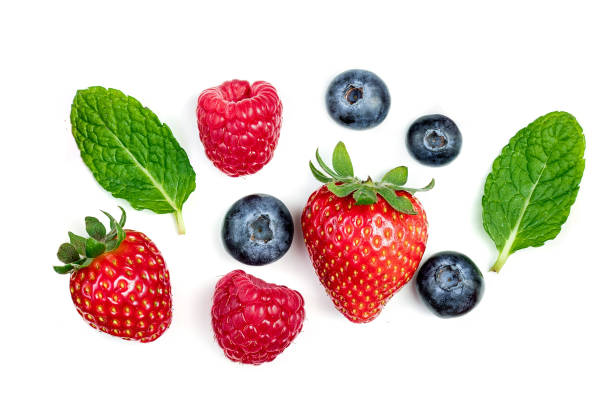 istock Fresh berries isolated on white background, Macro. Strawberry, Raspberry, Blueberries  and Mint leaf, flat lay 983497438