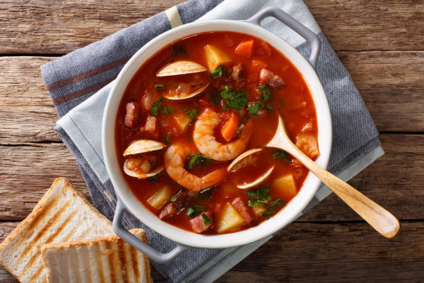 istock American cuisine: Manhattan clam chowder soup closeup. horizontal top view 983503104