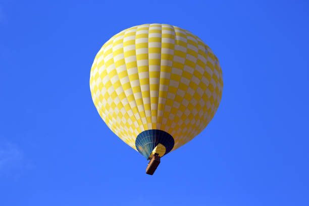 istock colored balloon with people flying in the sky in Cappadocia 983520682