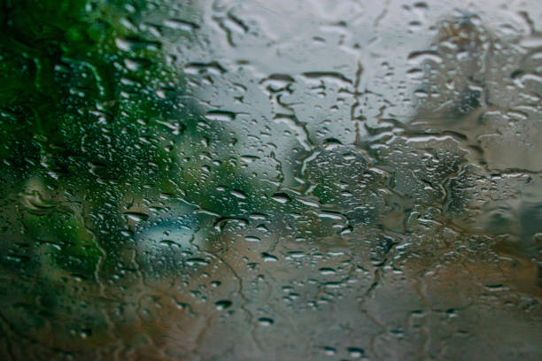 istock The first Rain falles when u driving the Car 983546976