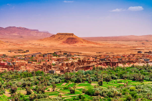 Kasbah and village in Morocco North Africa Kasbah and village in Morocco North Africa desert oasis stock pictures, royalty-free photos & images
