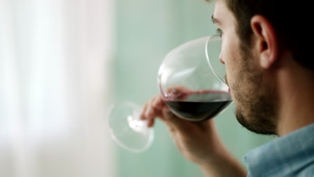 Close-up, man drinking red wine