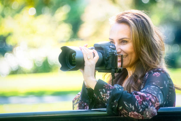 istock Mature female photographer 983576376