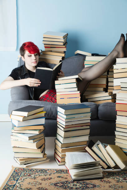 istock Young lady with dyed hair studying 983585818
